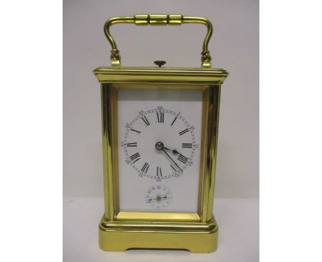 An early 20th century brass cased French cornice, repeater alarm carriage clock with white enamelled dial, Roman numerals and