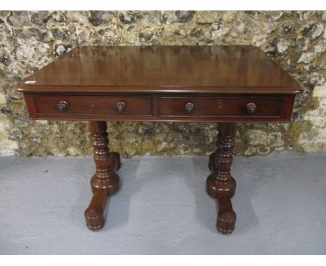 An early Victorian mahogany sofa table having twin inline drawers, with facsimiles on the reverse, over bobbin turned columns