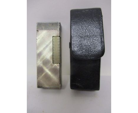 A Dunhill silver gas lighter with engine turned decoration, stamped 925 in a black leather pouch