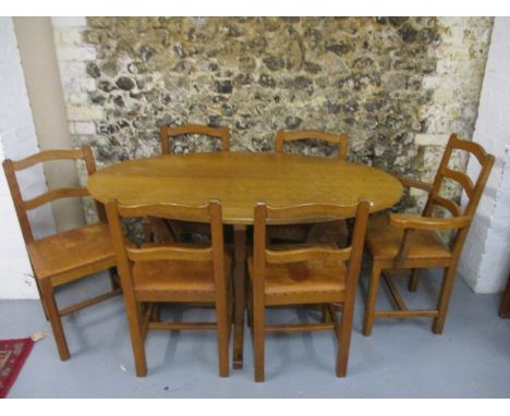 A 1960s Alan Granger 'Acornman' apprentice to Robert Thompson, 'Mouseman' - an oak oval dining table with a honeycomb carved 