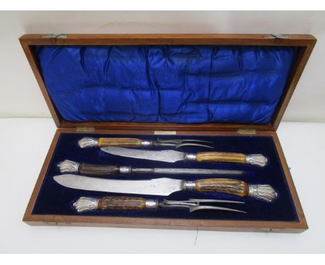 A Martin & Co, Cheltenham, five piece carving set with steel blades and tines on horn handles with silver terminals and ferru