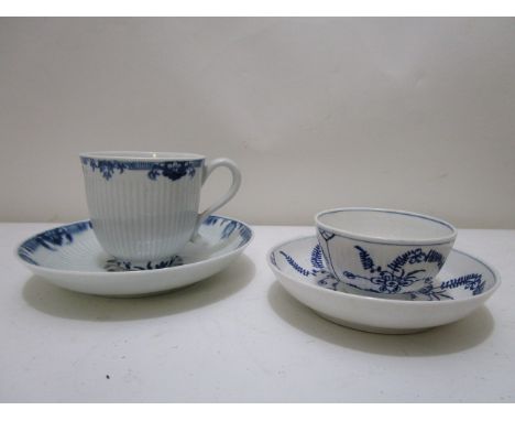 A Worcester porcelain blue and white coffee cup and saucer, with a vertically fluted body between two banks of floral decorat