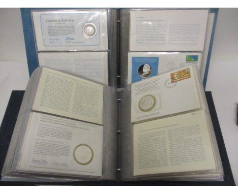 An album of thirty six 1st day covers and commemorative silver and silver gilt medals to include one commemorating Australia'