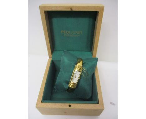A Pequignet modern ladies, gold plated quartz bangle wrist watch, white enamel dial marked P1.10 microns, 3514 to the reverse