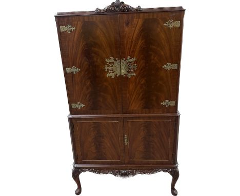 Mahogany brass hinged drinks cabinet with cabriel legs and glass shelves measures approximately 16 inches depth 60 inches tal