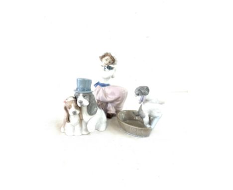 Three Nao figures includes Girl with dog, dog with brush and girl and boy dog