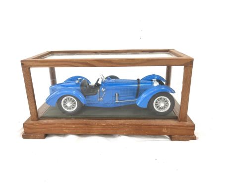 Sports car in display case 6 inches tall 5 inches depth inches wide
