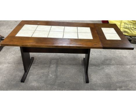Danish tile topped drop leaf table measures approximately 29 inches tall x 63 long and 31.5 wide