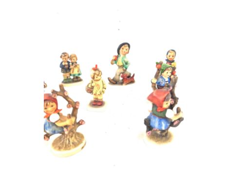 Large selection of assorted Hummel figures includes Girl on swing, Boy with dog and umbrella  etc