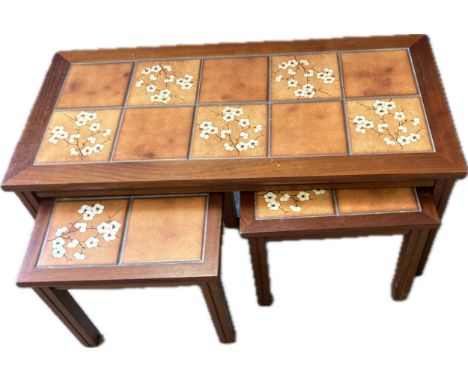 Teak tile top nest of table measures approx 16 inches tall x 35 wide and 16 deep