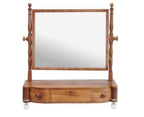  A Regency mahogany and boxwood strung dressing mirror  , circa 1815,  the rectangular plate on turned supports above the bow