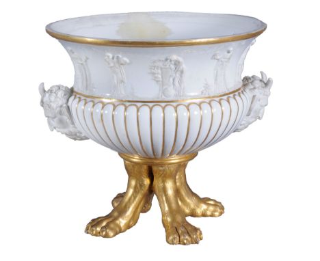  A Paris porcelain jardiniere  , circa 1820,  the upper part moulded with white bisque classical figures, the lower half reed