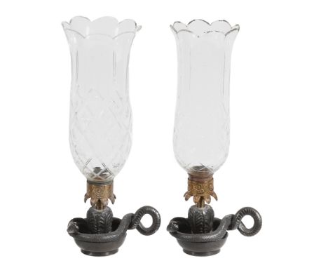  A pair of bronze and ormolu hurricane lamps  , first half 19th century, the glass chimneys above Vitruvian scroll collar and