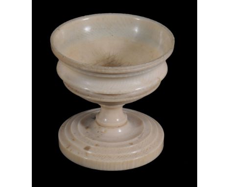  An ivory urn-shaped pedestal salt cellar,   early 19th century, 8.5cm high 