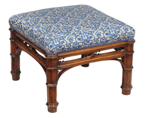  A Victorian Gothic Revival walnut stool  , circa 1860,  the stuffed square seat over a pierced tracery frieze and collared o