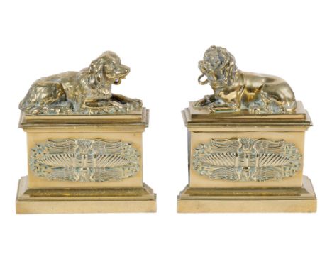 A pair of gilt bronze chenets, third quarter 19th century, one with a recumbent poodle and one with a spaniel, on pedestal ba