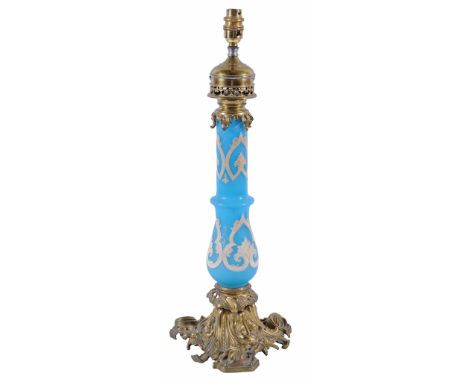  A Victorian blue and white glass and gilt metal oil lamp  , last quarter 19th century,  with baluster stem and foliate base,
