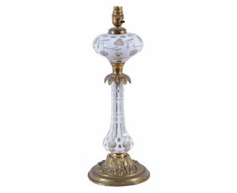  A Victorian white flashed glass and gilt mounted oil-lamp,   last quarter 19th century, fitted for electricity as a lamp, 49