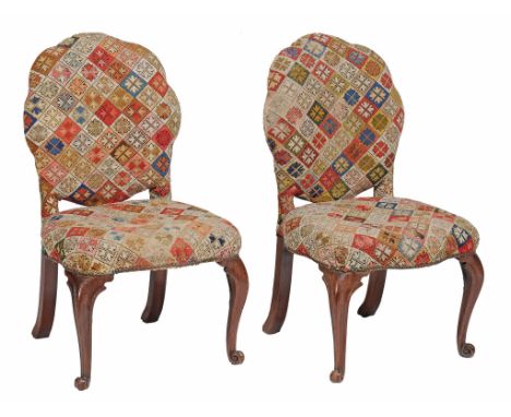  A pair of George III mahogany salon chairs  , circa 1770, the tapestry upholsterd and padded oval backs over similar seats, 