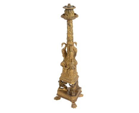  A Regency gilt-bronze large candlestick  , circa 1815, with bird and branch tapering cylidrical column with three supporting
