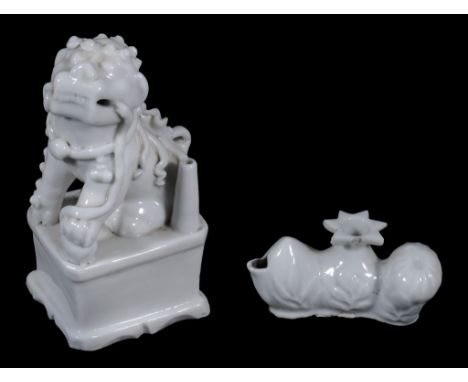  A Dehua "Buddhist lion" joss stick holder, Qing Dynasty, 18th century,  seated on a rectangular base, 13.5cm high;;   and a 