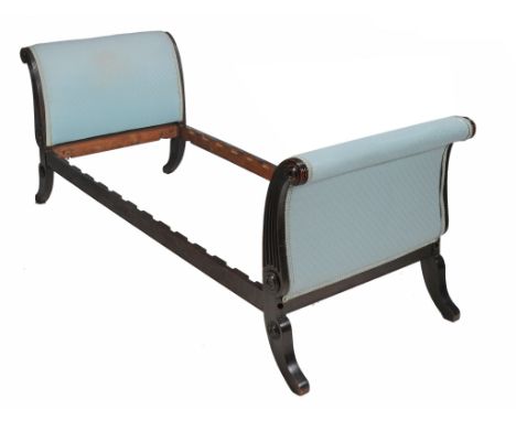  A Regency ebonised day bed  , circa 1815,  with padded scrolled ends of equal height, the front fluted and will moulded bull