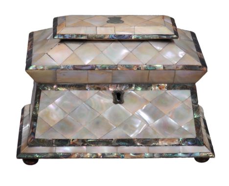  A Victorian mother of pearl and abalone tea caddy,   circa 1850, lozenge veneered with a faceted hinged top and a canted fro