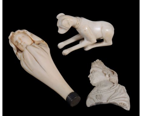 An ivory seal, carved as a bust of a child veiled in a shroud, 19th century, the matrix unengraved, 13cm long; and a carved b