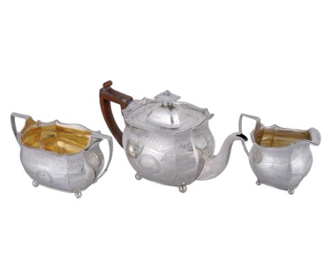  A George III silver oblong three piece tea service by Alice  &  George Burrows II,   London 1805, with a rectangular finial 