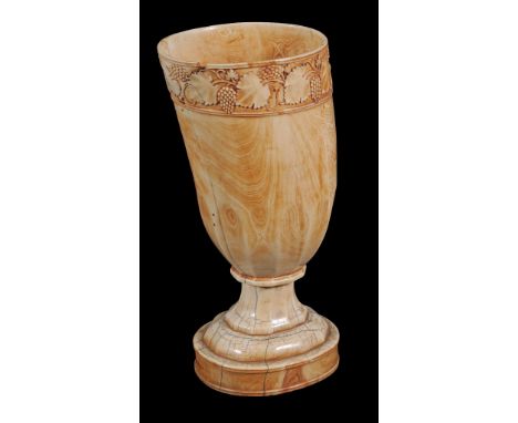  A carved ivory tusk vase,   19th century, the rim carved with a band of fruiting vine, on a pedestal base, 32cm high 