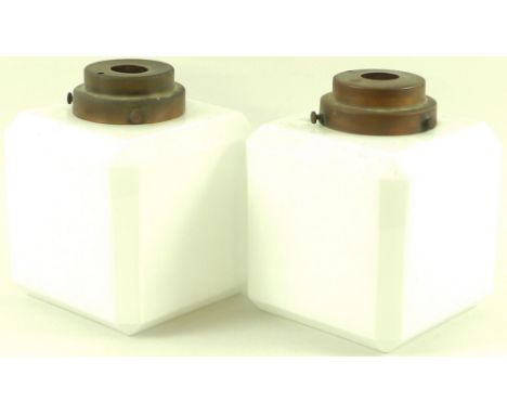 A pair of mid 20th century white glass cube form light shades, bevelled edges, brass mounts, 15 by 18.5cm. (2)