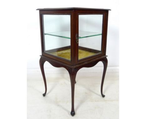 An Edwardian mahogany and inlaid vitrine, glazed display case, with single glass shelf, single door, with key, raised on slen