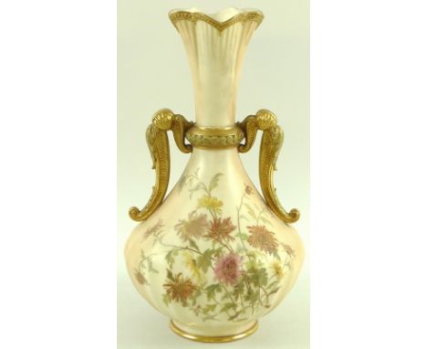 A large Royal Worcester blush ivory twin handled vase, the body painted with chrysanthemums, with gilded highlights throughou