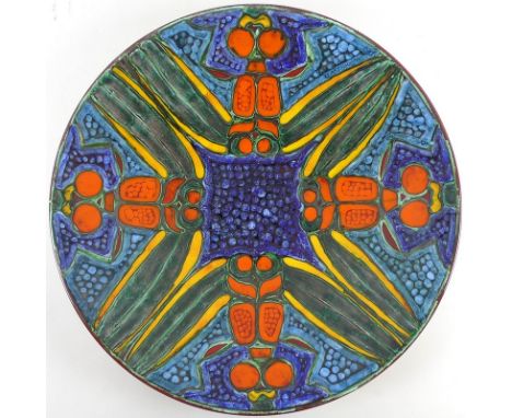 A Poole Pottery studio charger, painted by Tony Morris, quartered dragonfly pattern with blue, green, yellow and orange glaze