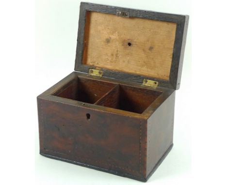 A George III walnut tea caddy of rectangular form, inlaid with rope stringing and central oval paterae, with ivory knop, and 