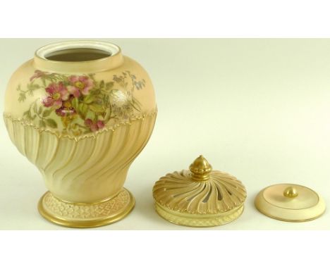 A Royal Worcester blush ivory pot pourri, vase with lid and swirl pierced cover, of swirled baluster form, painted with sprin
