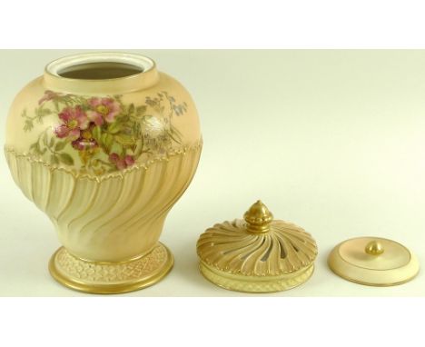 A Royal Worcester blush ivory pot pourri, vase with lid and swirl pierced cover, of swirled baluster form, painted with sprin