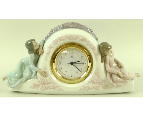 A Lladro clock with figures either side, model 5776, 'Two Sisters', together with a bisque Lladro bell, three Lladro figurine