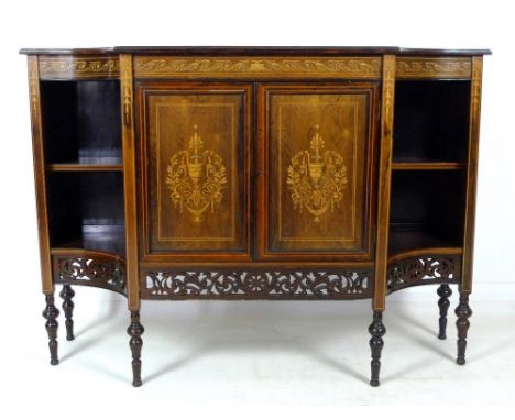 A late Victorian rosewood, line and marquetry inlaid sideboard, with shaped surface over an scrolling inlaid frieze, central 