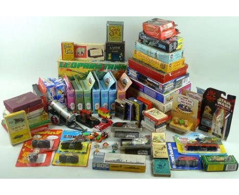 A large collection of vintage and modern toys, including a Junior Spill-Wobble game in original box, a variety of models depi