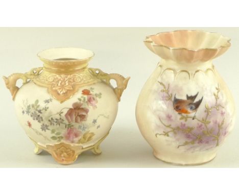 A Royal Worcester blush ivory twin handled vase of squat form with dolphin handles, the body painted with flowers, with gilde