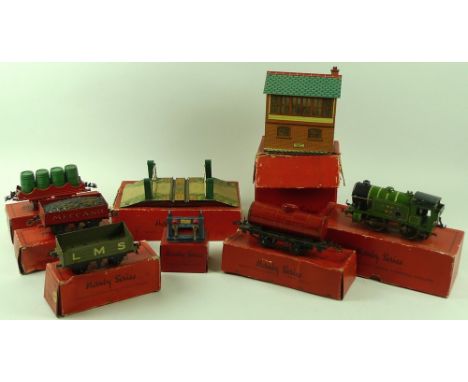 A group of Hornby 'O' guage railway locomotives, carriages, tracks and accessories comprising a set comprising 293C clockwork