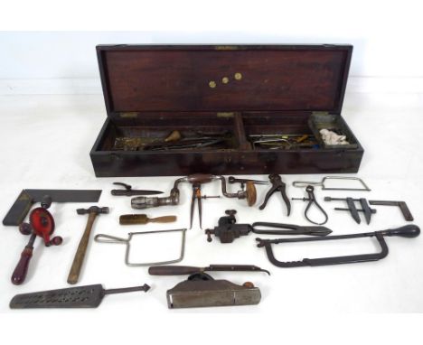 A vintage mahogany tool chest, early 20th century, with inset brass ring handle, campaign corners, and circular brass inlay w