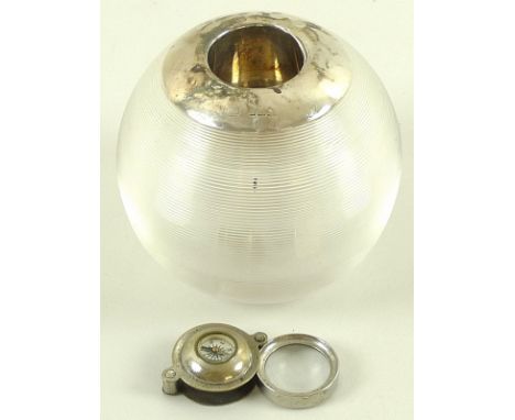 A ribbed clear glass table vesta with silver collar, marks indistinct, 8cm, together with a white metal compass, hinged loupe