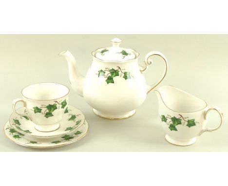 A Colclough bone china dinner service, decorated with sprigs of ivy with gilt edging, comprising teapot, milk jug, sucrier, t