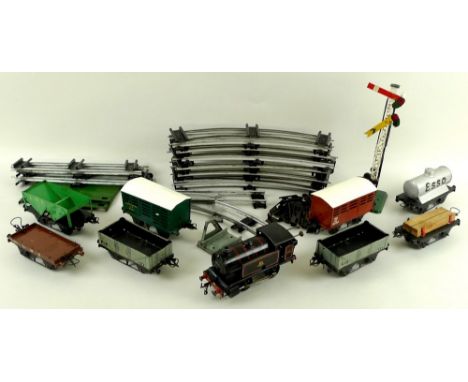 A Hornby Meccano Ltd, O gauge, tinplate clockwork train set, comprising 0-4-0 tank engine Type 40, black with red detail, wit