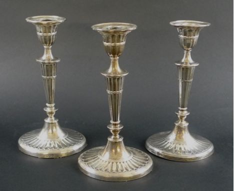 A pair of Victorian silver candlesticks, Regency style, with fluted columns and oval bases, weighted, retailed by Sussex Gold