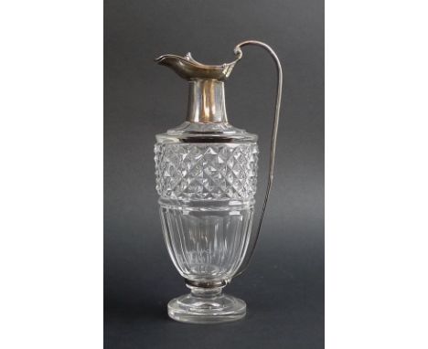 A George III silver mounted cut glass ewer, by Paul Storr, the hinged and covered top with silver gilt interior, with scrolle