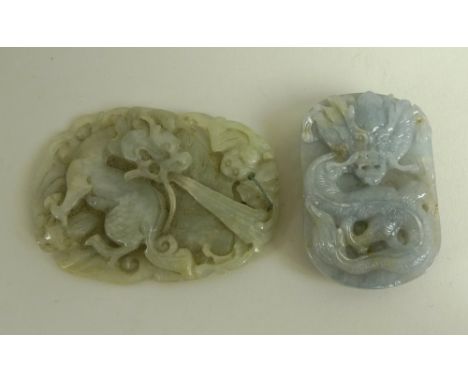A jade pendant, carved as a fire dragon with two good luck bats, 7 by 5cm, together with a grey jade belt buckle with dragon 
