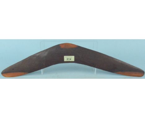A late 19th Century hardwood aboriginal boomerang with fine chip carved animal and bird decoration